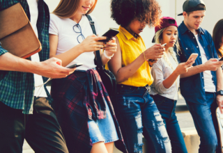 Diverse,Friends,Using,Their,Phones