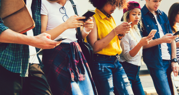 Diverse,Friends,Using,Their,Phones